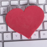 Heart on computer keyboard in online dating concept